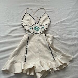 Fashion Nova - Ivory Embroidered Cut
Out Ruffle Hem Romper